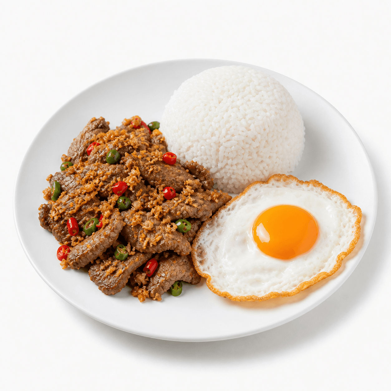 ข้าวราดเนื้อทอดกระเทียมพริกขี้หนูสวน + ไข่ดาว